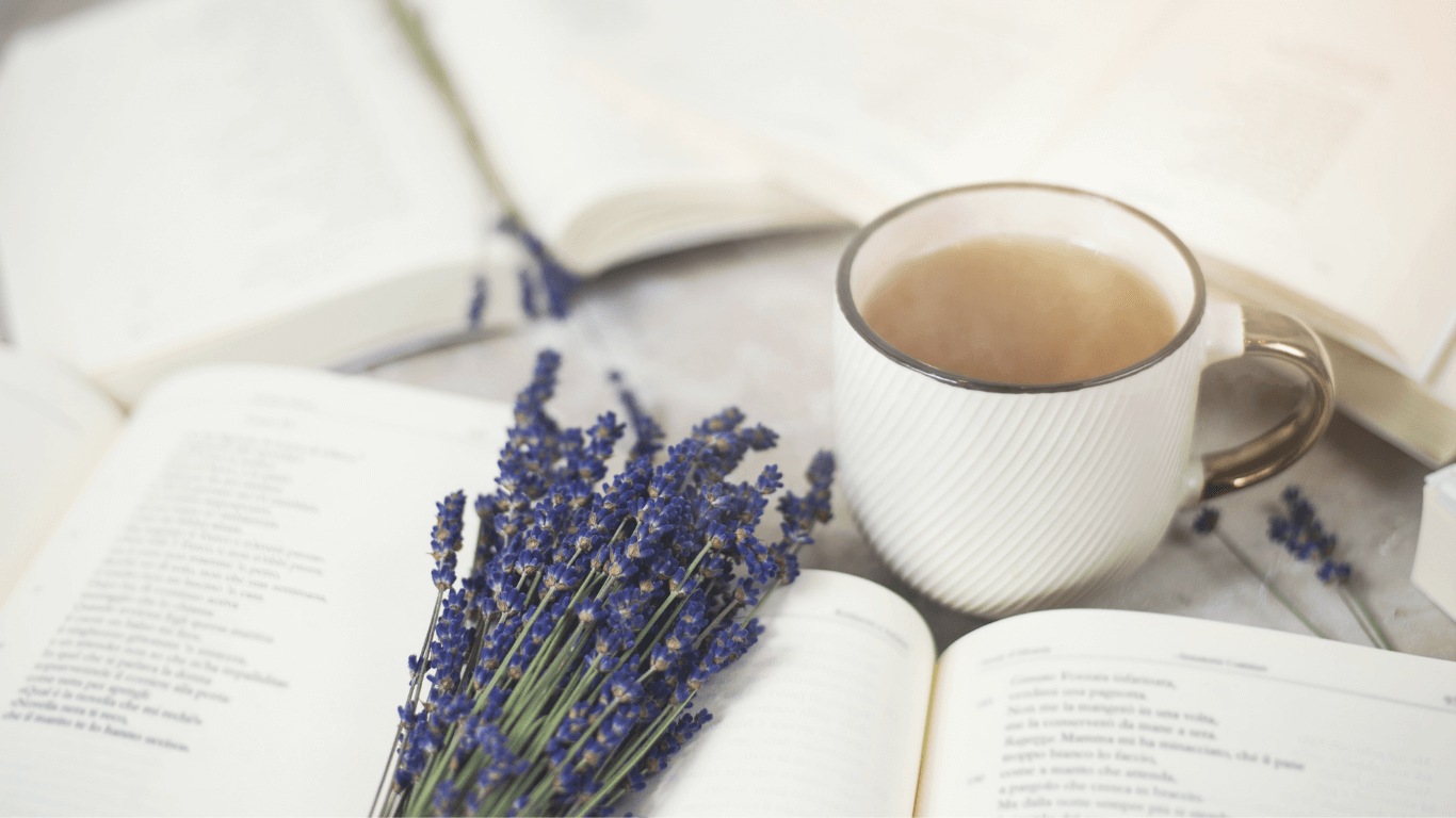 Lavender sprig and cup of tea with book